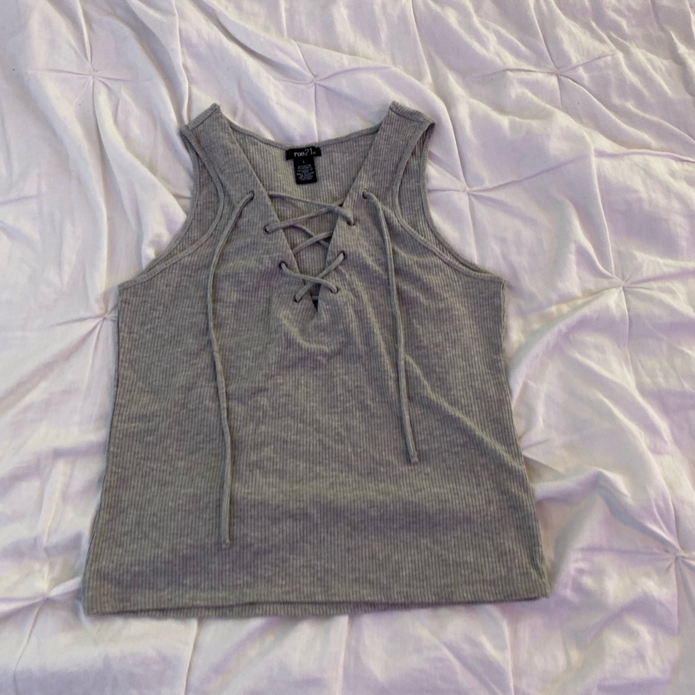 Grey crisscross tank top.